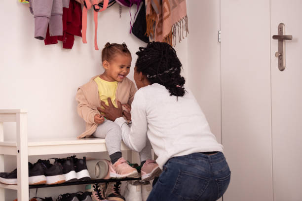 istock Mother and daughter having fun while preparing themself to go to kindergarten. 1441093904