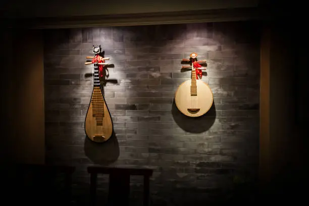 Photo of Asian musical instruments, pipa hanging on the wall