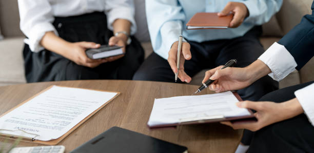 istock Real Estate Agent explain insurance and sign contract agreement contract to client. 1441098676