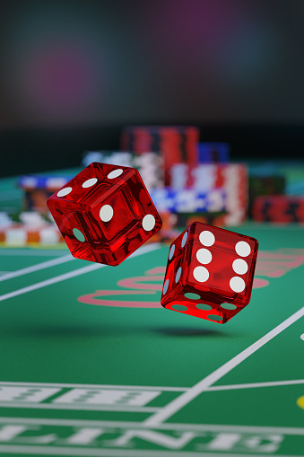 Close up of a pair of dice rolling down a craps table.Gambling concept. 3d illustration.
