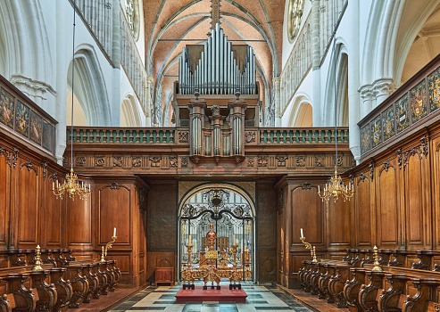 Bruges, Belgium - July 20, 2020: The woodenn choir and the main organ of  the Church of Our Lady