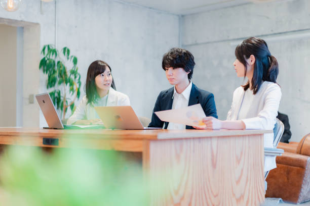 istock Young businessperson discussing in office 1441106247