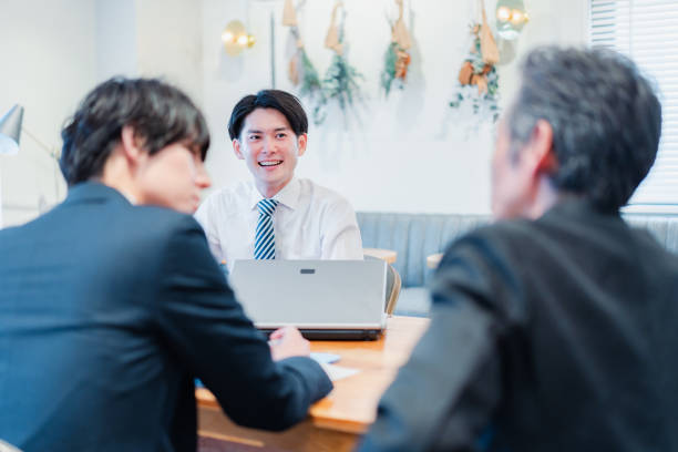 istock Businessman having a conversation in his office 1441108083