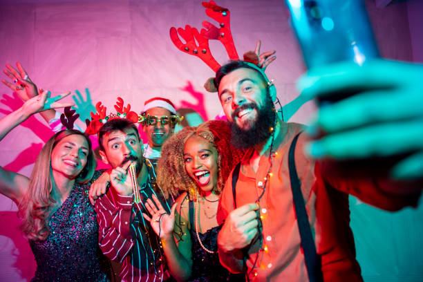 istock Friends taking selfies at New Year party 1441115333