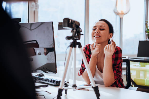istock A young woman using a camera to present her business with online clients 1441116322