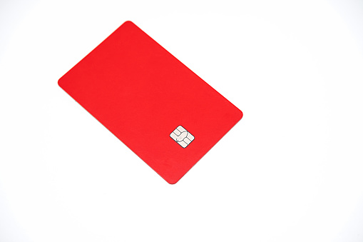 Mock up plastic credit card with EMV chip on white.