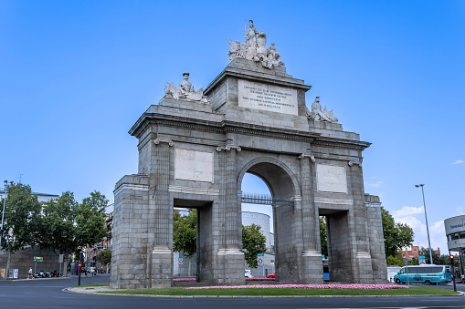Madrid, Spain - July 11, 2022: The Puerta de Toledo is a gate located in Madrid, Spain. It was declared Bien de Interés Cultural in 1996. Construction began in 1812, but was not completed until 1827. It was one of the nineteen city gates within the Walls of Philip IV.