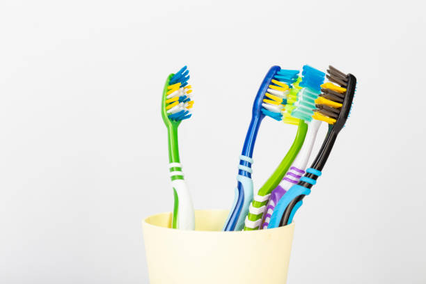 istock Holder with toothbrushes on white background. 1441117684