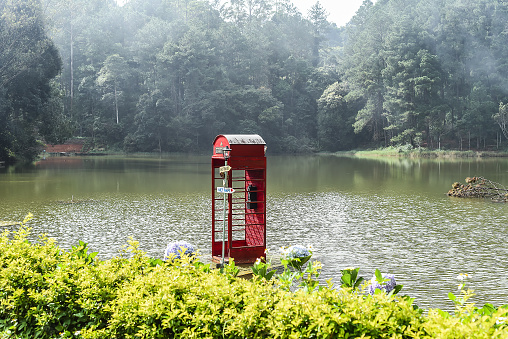 Da Lat, Vietnam - 2 November 2022: Telephone booth inside of water of Xuan Huong Lake