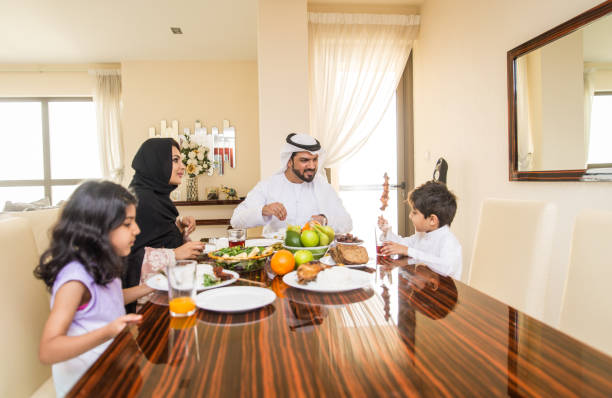 istock Arabian family having meal at home 1441119256
