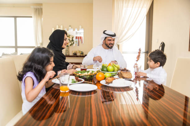 istock Arabian family having meal at home 1441120067