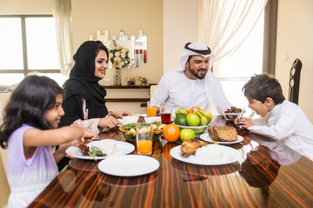 istock Arabian family having meal at home 1441120171