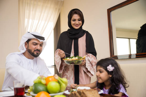 istock Arabian family having meal at home 1441120338