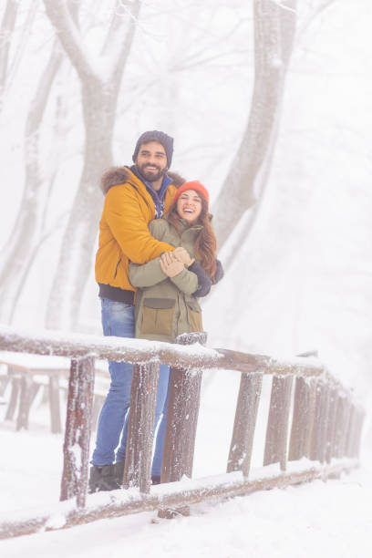 istock Couple relaxing outdoors on snowy winter day 1441120559