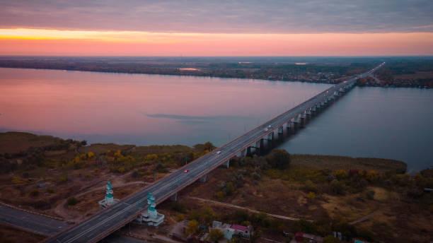 The road to Krym through the Kherson Bridge in Antonovka. The road to Krym through the Kherson Bridge in Antonovka. A bridge across the Dnieper River connecting the right and left banks melitopol stock pictures, royalty-free photos & images