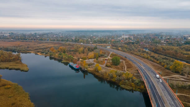 The road to Krym through the Kherson Bridge in Antonovka. The road to Krym through the Kherson Bridge in Antonovka. A bridge across the Dnieper River connecting the right and left banks melitopol stock pictures, royalty-free photos & images