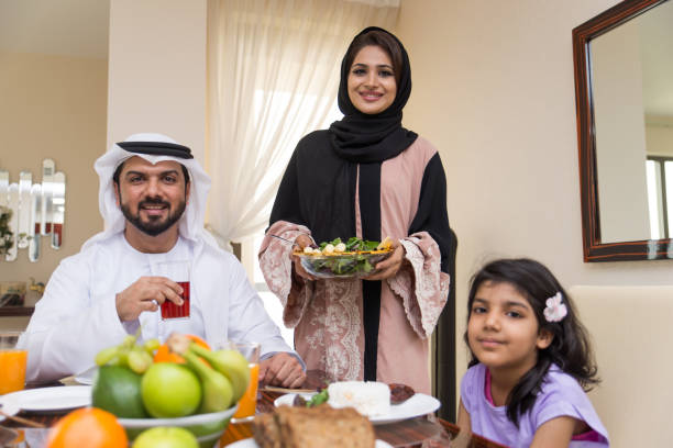 istock Arabian family having meal at home 1441122961