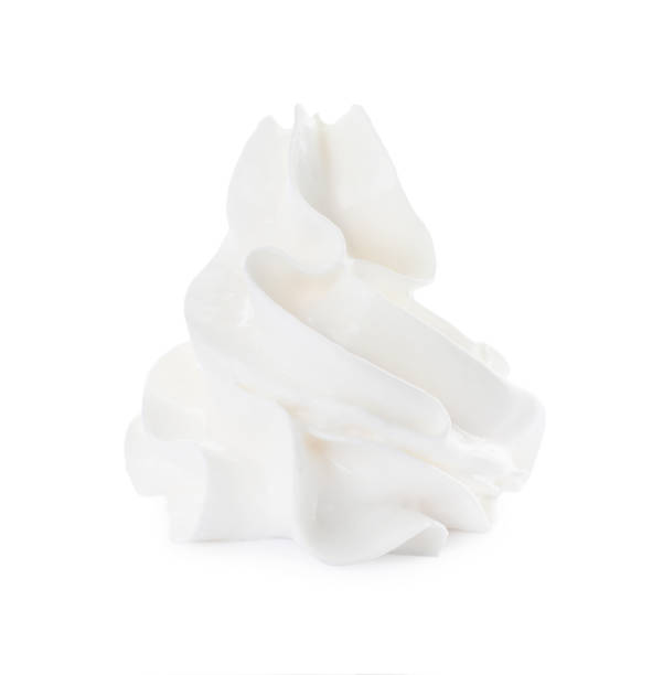 istock Delicious whipped cream swirl isolated on white 1441122977
