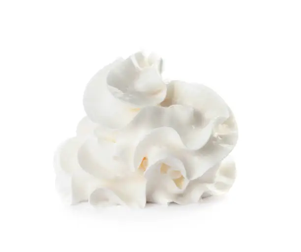 Photo of Delicious whipped cream swirl isolated on white
