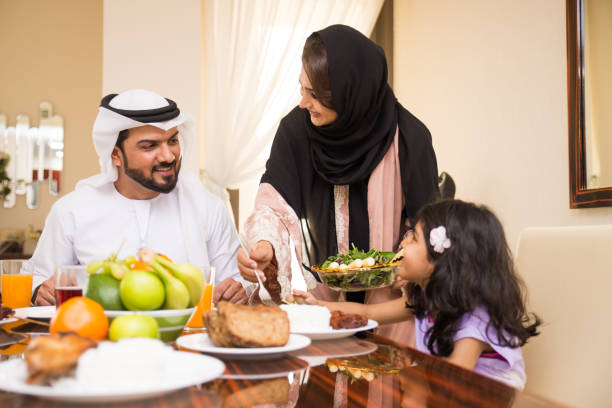 istock Arabian family having meal at home 1441123030