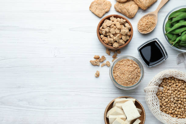 istock Different organic soy products on white wooden table, flat lay. Space for text 1441123077