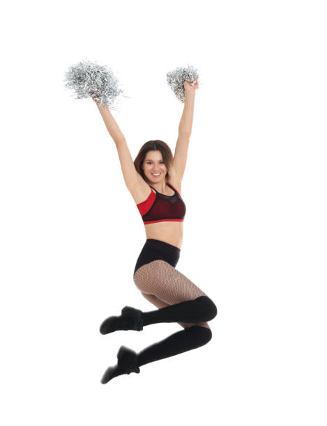 istock Beautiful cheerleader with pom poms jumping on white background 1441123289