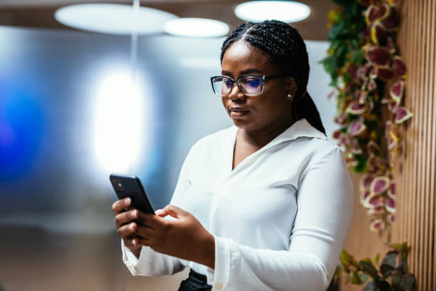 istock African businesswoman using smart phone in office 1441126355