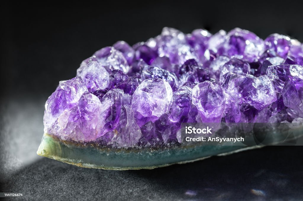 Amethyst crystal druzy a purple variety of quartz Amethyst Crystal Cluster a Purple Variety of Quartz over Black Background. Healing Crystal Concept, Amethyst is Good for Relieve Anxiety and Stress. Natural Mineral Stone Collection Amethyst Stock Photo