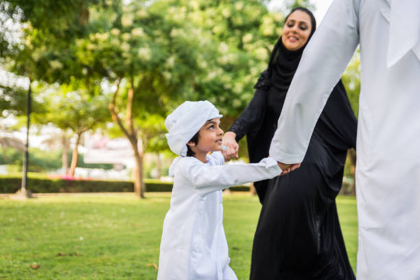 istock Happy arabian family in a park 1441126868
