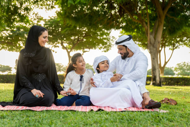 istock Happy arabian family in a park 1441126891