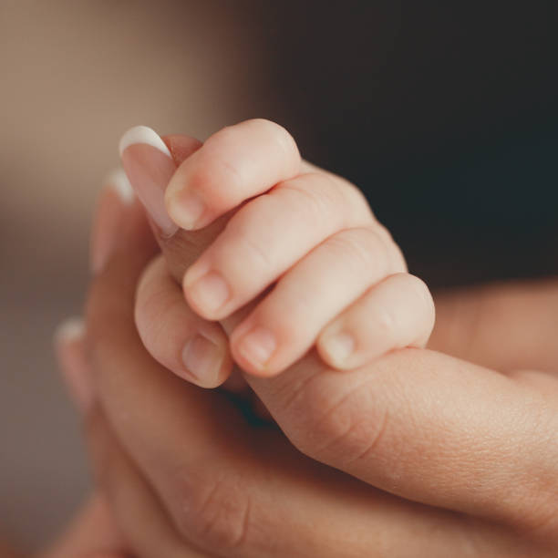 istock Kid holding mom mom ha thumb. 1441126984