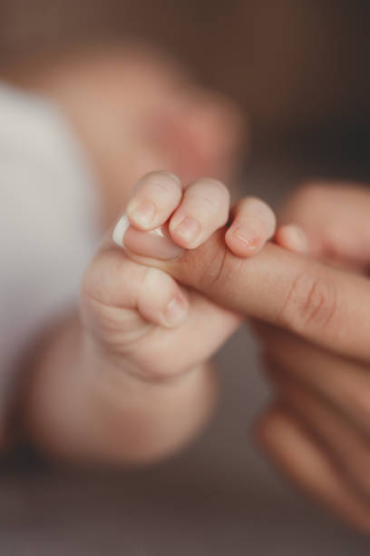 istock Kid holding mom mom ha thumb. 1441126985