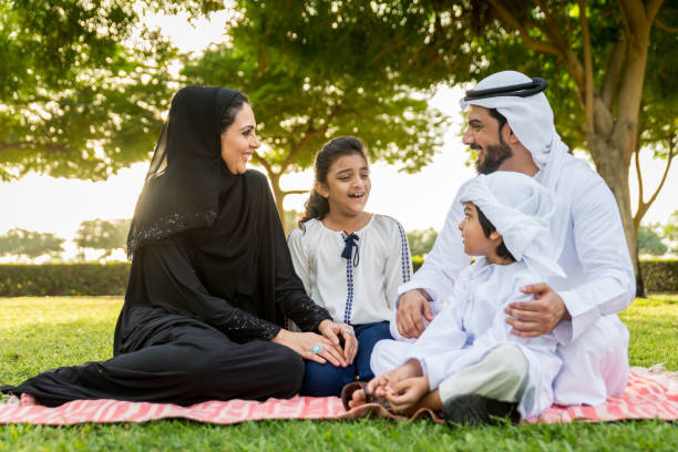 istock Happy arabian family in a park 1441127655