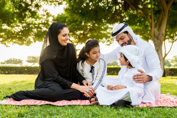 istock Happy arabian family in a park 1441127904