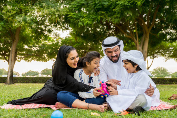 istock Happy arabian family in a park 1441128116