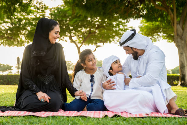 istock Happy arabian family in a park 1441128144