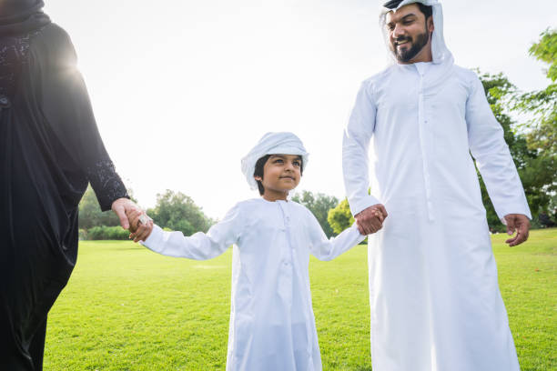 istock Happy arabian family in a park 1441128196