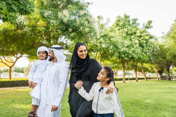 istock Happy arabian family in a park 1441128218