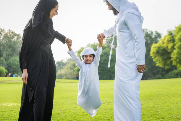 istock Happy arabian family in a park 1441128259