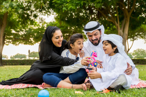 istock Happy arabian family in a park 1441128274