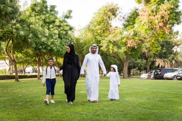 istock Happy arabian family in a park 1441128310