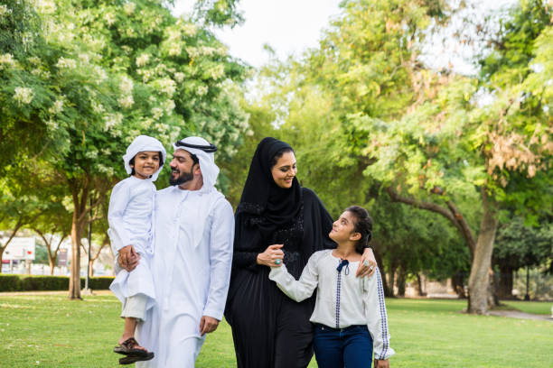 istock Happy arabian family in a park 1441128320