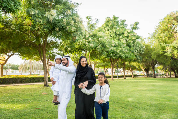 istock Happy arabian family in a park 1441128344