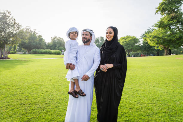 istock Happy arabian family in a park 1441128391