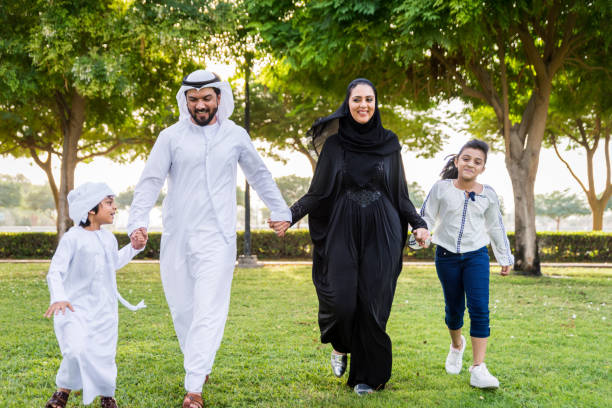 istock Happy arabian family in a park 1441128462
