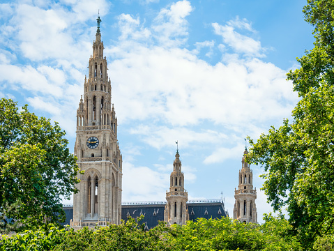Vienna, Austria - June 2022: Front view with the Rathaus, city or town hall in Vienna, Austria built in gothic architectural style and located on Rathausplatz .