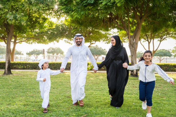 istock Happy arabian family in a park 1441129165