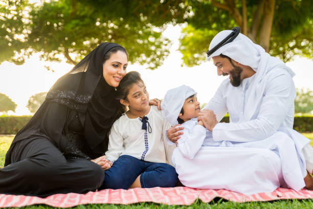 istock Happy arabian family in a park 1441129216