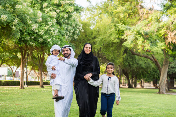 istock Happy arabian family in a park 1441129238