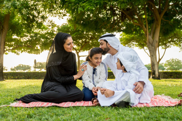 istock Happy arabian family in a park 1441129309